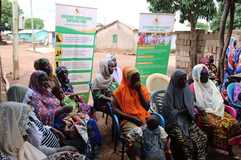 Women listening closely during a community meeting
